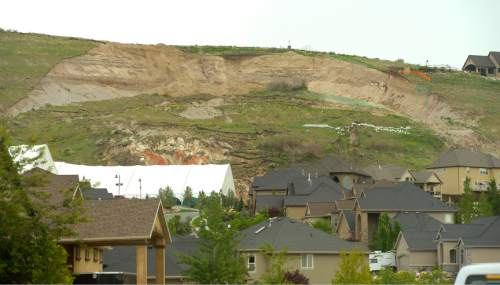 Leah Hogsten  |  Tribune file photo
The view of the landslide in Eaglepointe Estates in North Salt Lake that destroyed one North Salt Lake home and damaged a tennis club in 2014, May 5, 2015. The city of North Salt Lake has a remediation plan ready to go and even a contractor to do the work, which would cost about $2 million. The city has agreed to chip in $200,000, but the developer, Sky Properties, hasn't agreed to pay anything yet.