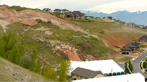 Leah Hogsten  |  The Salt Lake Tribune
The view of the landslide in Eaglepointe Estates in North Salt Lake that destroyed one North Salt Lake home and damaged a tennis club in 2014, May 5, 2015. The city of North Salt Lake has a remediation plan ready to go and even a contractor to do the work, which would cost about $2 million. The city has agreed to chip in $200,000, but the developer, Sky Properties, hasn't agreed to pay anything yet.