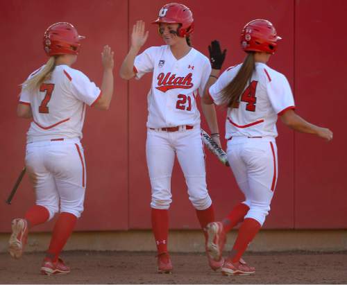 Leah Hogsten  |  The Salt Lake Tribune
Utah's Shelbi Everett (center) celebrates the team's two runs from Kristen Stewart and Maddy Woodard in the bottom of the 7th inning. The University of Utah softball team was defeated during their home debut, Saturday, by Oregon, 4-2, March 21, 2015 .
