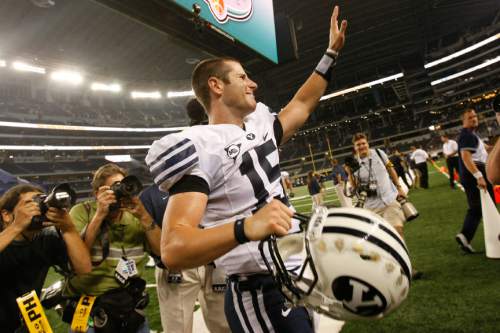 Brigham Young's Max Hall #15 waves to the crowd as he walks off of the field after the game against Oklahoma at Cowboys Stadium Saturday September 5, 2009. BYU won the game 14-13

Photo by Chris Detrick/The Salt Lake Tribune
