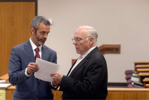 Al Hartmann | The Salt Lake Tribune
Defense attorneys for Meagan Grunwald, Rhome and Dean Zabriskie, confer during a break in the trial Wednesday May 6, 2015. Grunwald took the witness stand in her own defense. She is charged as an accomplice in a shooting spree that killed one police officer and wounded another on Jan. 30, 2014.