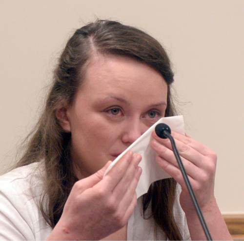 Al Hartmann |  The Salt Lake Tribune
Meagan Grunwald cries on the witness stand testifying in her own defense Wednesday May 6, 2015, in Judge Darold McDade's courtroom in Provo.  She is charged as an accomplice in a shooting spree that killed one police officer and wounded another on Jan. 30, 2014.