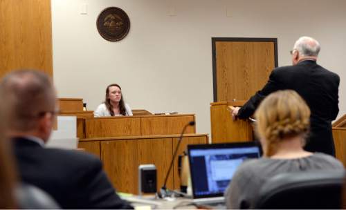Al Hartmann |  The Salt Lake Tribune
Defense lawyer Dean Zabriskie, right, interviews Meagan Grunwald as she takes the witness stand in her own defense Wednesday May 6, 2015, in Judge Darold McDade's courtroom in Provo. She is charged as an accomplice in a shooting spree that killed one police officer and wounded another on Jan. 30, 2014.
