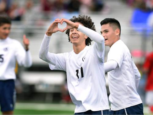 Scott Sommerdorf   |  The Salt Lake Tribune
American Leadership Academy's Juve Almanza makes a heart symbol towards fans after he scored ALA's third goal of the first half as ALA defeated Manti 4-0 in a 3A semi-final played at Juan Diego High, Friday, May 8, 2015. To the right is team mate Xavier Medina.
