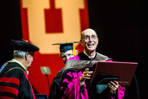Chris Detrick  |  The Salt Lake Tribune
Henry B. Eyring, First Counselor in the First Presidency of The Church of Jesus Christ of Latter-day Saints, receives an honorary Doctorate in Humane Letters during the University of Utah Commencement Ceremony at the Jon M. Huntsman Center Thursday May 7, 2015.