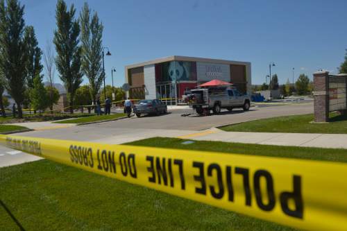 Chris Detrick  |   Tribune file photo
The scene outside of a Panda Express in Saratoga Springs Wednesday September 10, 2014.  A male -- who reportedly was seen wielding a samurai sword -- was shot and killed by police in Saratoga Springs on Wednesday morning.