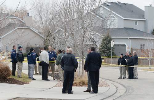 Francisco Kjolseth  |   Tribune file photo
Draper and West Valley police officers investigate the scene of an officer involved shooting in the Cranberry Hill neighborhood in Draper on Wednesday morning, Jan. 14, 2015. A West Valley police officer on his way to work who asked for back up from Draper police on a possible narcotics arrest shot and killed the suspect when he brandished a knife during the struggle to arrest him.