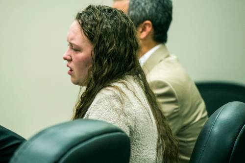 Chris Detrick  |  The Salt Lake Tribune
Meagan Grunwald reacts as the guilty verdict is read at 4th District Court in Provo on Saturday. Eighteen-year-old Meagan Dakota Grunwald has been found guilty of 11 of 12 charges, including aggravated murder and attempted aggravated murder, for her role in a 2014 crime spree that left one officer dead and another wounded. She faces up to life in prison. She will be sentenced July 8.