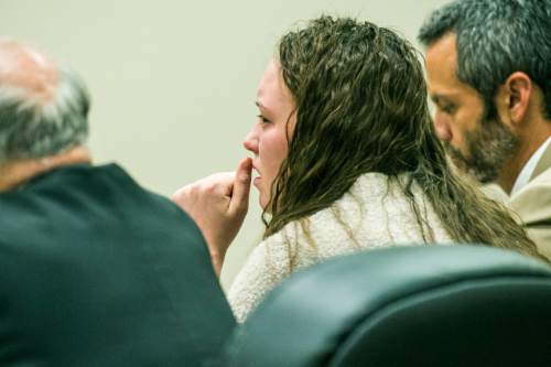 Chris Detrick  |  The Salt Lake Tribune
Meagan Grunwald reacts as the guilty verdict is read at 4th District Court in Provo Saturday May 9, 2015. Eighteen-year-old Meagan Dakota Grunwald has been found guilty of 11 of 12 charges, including aggravated murder and attempted aggravated murder, for her role in a 2014 crime spree that left one officer dead and another wounded. She faces up to life in prison. She will be sentenced July 8.