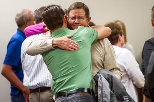 Chris Detrick  |  The Salt Lake Tribune
Blake Wride hugs Ryan Wride at 4th District Court in Provo on Saturday. Eighteen-year-old Meagan Dakota Grunwald has been found guilty of 11 of 12 charges, including aggravated murder and attempted aggravated murder, for her role in a 2014 crime spree that left one officer dead and another wounded. She faces up to life in prison. She will be sentenced July 8.