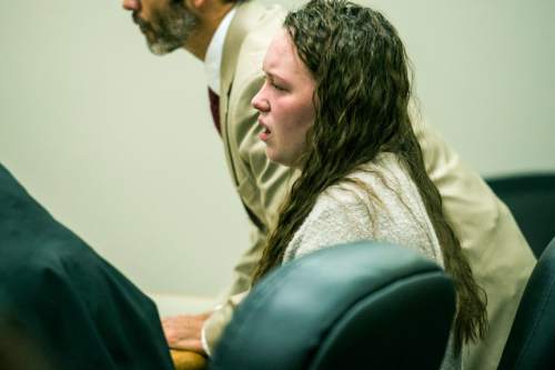 Chris Detrick  |  The Salt Lake Tribune
Meagan Grunwald reacts as the guilty verdict is read at 4th District Court in Provo Saturday May 9, 2015. Eighteen-year-old Meagan Dakota Grunwald has been found guilty of 11 of 12 charges, including aggravated murder and attempted aggravated murder, for her role in a 2014 crime spree that left one officer dead and another wounded. She faces up to life in prison. She will be sentenced July 8.