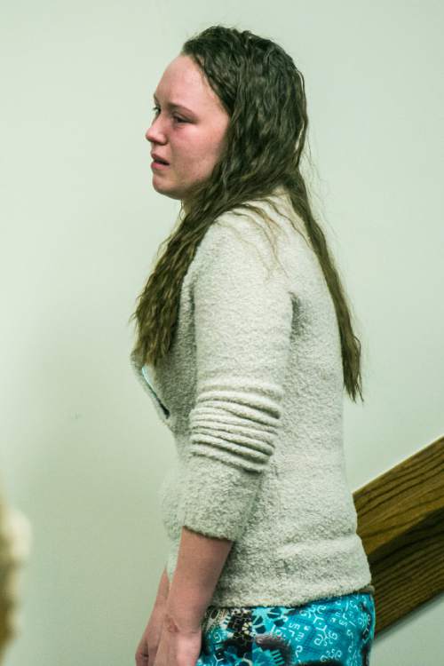 Chris Detrick  |  The Salt Lake Tribune
Meagan Grunwald leaves the 4th District Court in Provo Saturday May 9, 2015. Eighteen-year-old Meagan Dakota Grunwald has been found guilty of 11 of 12 charges, including aggravated murder and attempted aggravated murder, for her role in a 2014 crime spree that left one officer dead and another wounded. She faces up to life in prison. She will be sentenced July 8.