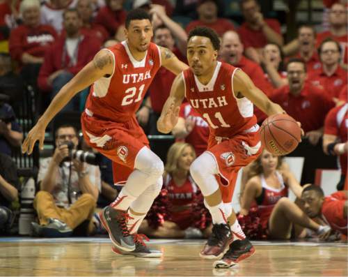 Rick Egan  |  The Salt Lake Tribune

 Utah guard Brandon Taylor (11) leads  fast break for the Utes, as Utah Utes forward Jordan Loveridge (21) trails behind, in Pac-12 Basketball Championship action Utah vs. Oregon, at the MGM Arena, in Las Vegas, Friday, March 13, 2015.