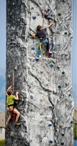 Steve Griffin  |  The Salt Lake Tribune

Youngsters climb on a portable climbing wall during the Baby Animal Days at the USU Botanical Center in Kaysville, Utah Friday, May 8, 2015.
