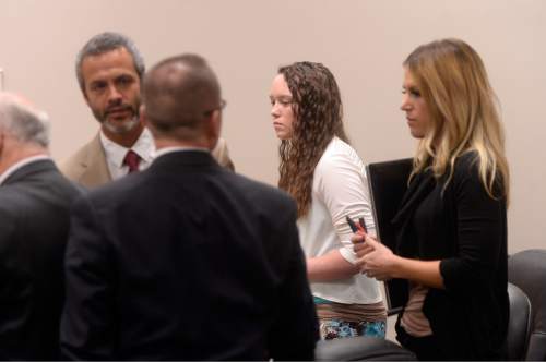 Al Hartmann |  The Salt Lake Tribune
Lawyers shake hands at the conclusion of the Meagan Grunwald trial in Provo Friday  May 8.  Grunwald is charged as an accomplice in a shooting spree that killed one police officer and wounded another on January 30, 2014.