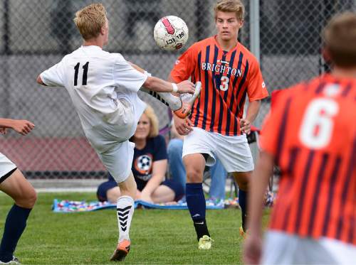 Scott Sommerdorf   |  The Salt Lake Tribune
Alta's Bryson Colemere kicks the ball while being defended by Brighton's Doug Regehr during second half play. Alta beat Brighton 3-0 at Alta High, Thursday, May 7, 2015.