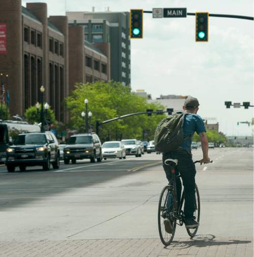 Francisco Kjolseth  |  The Salt Lake Tribune 
Cyclists ride the streets of downtown Salt Lake City on Monday, May 11, 2015.