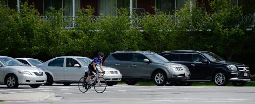 Francisco Kjolseth  |  The Salt Lake Tribune 
Cyclists ride the streets of downtown Salt Lake City on Monday, May 11, 2015.