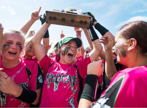 Steve Griffin  |  The Salt Lake Tribune
South Summit senior Sidney Vidrine screams as she holds up the state championship trophy as she celebrates with her teammates after defeating San Juan twice giving them the 2A high school softball championship at the Spanish Fork Complex in Spanish Fork, Monday, May 11, 2015.