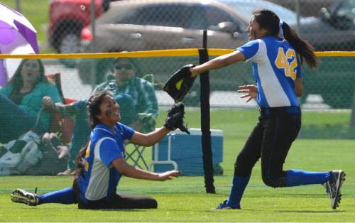 Steve Griffin  |  The Salt Lake Tribune


Sharla Yanito, right, snags a fly ball as her teammate Nizhonii Begaye dives for the ball during 2A high school softball championship game against South Summit at the Spanish Fork Complex in Spanish Fork, Monday, May 11, 2015.