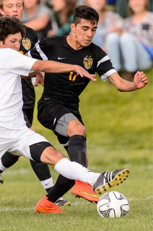 Trent Nelson  |  The Salt Lake Tribune
Wasatch's Jesse Lopez Ramirez (17) with the ball in a first round Class 4A soccer state game between Wasatch and Skyline High School, in Salt Lake City, Wednesday May 13, 2015.