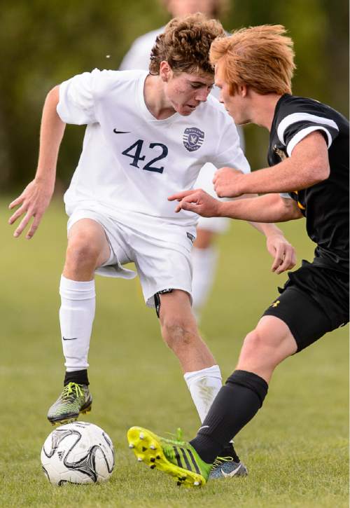 Trent Nelson  |  The Salt Lake Tribune
Skyline's Nathan Jensen (42) controls the ball, with Wasatch's Jaden Hills (1) defending, in a first round Class 4A soccer state game between Wasatch and Skyline High School, in Salt Lake City, Wednesday May 13, 2015.
