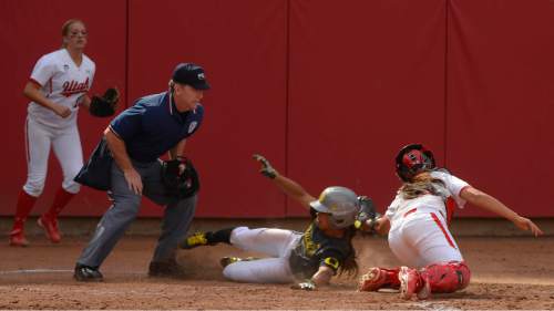 Leah Hogsten  |  The Salt Lake Tribune
Oregon's Lexy Beaudrie-Pierson is safe from the glove of Utah's catcher Shelby Pacheco.  The University of Utah softball team was defeated during their home debut, Saturday, by Oregon, 4-2, March 21, 2015 .