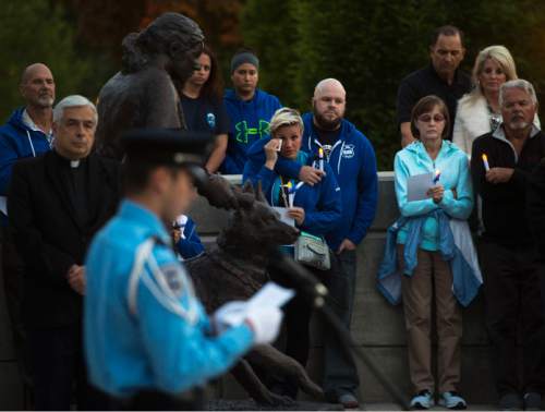Steve Griffin  |  The Salt Lake Tribune

Names of the Utah officers who have died in the line of duty are read by members of the Salt Lake City Police Department Explorers during a candlelight vigil hosted by the Utah Fraternal Order of Police, along with the Utah Fraternal Order of Police Auxiliary, to show appreciation to police officers who died in the line of duty at the The Utah Law Enforcement Memorial on the Utah State Capitol grounds in Salt Lake City, Wednesday, May 13, 2015.