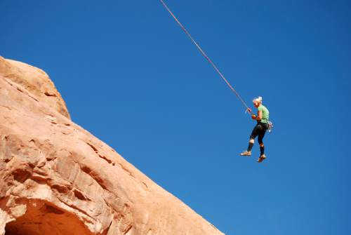 Brian Maffly  |  Tribune file photo
Corona Arch near Moab has become what is billed as the world's largest rope swing after climbers figured out how to adapt climbing gear to set up a thrilling 250-foot pendulum ride under the arch.