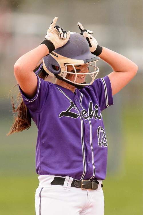 Trent Nelson  |  The Salt Lake Tribune
Lehi's Emme Cluff celebrates after hitting a double during a 5A softball tournament second-round game between defending champion Lehi and No. 1 seed Taylorsville, Thursday May 14, 2015.
