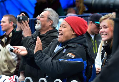 Scott Sommerdorf   |  The Salt Lake Tribune
Judge coach Mele Vaisima applauds for her shot put athlete Bapa Felemaka who won the 4A shot put at the 2015 Utah State High School Track and Field Championships, held at Clarence Robinson stadium at BYU, Saturday, May 16, 2015.