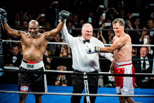 Chris Detrick  |  The Salt Lake Tribune
Mitt Romney reacts after boxing Evander Holyfield at the Rail Event Center Friday May 15, 2015. Holyfield won after Romney threw in the towel after two rounds. Friday's Romney-Holyfield showdown raised over $1 million for CharityVision, a 20-year-old nonprofit dedicated to saving the eyesight of impoverished people in developing nations.