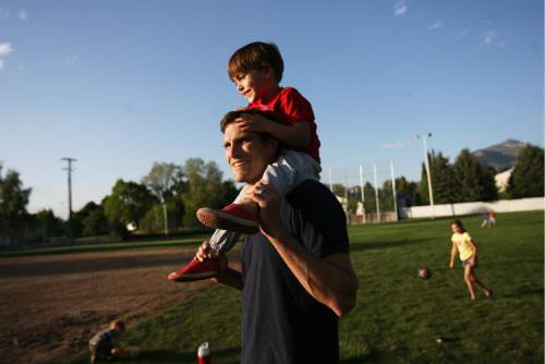 Kim Raff | The Salt Lake Tribune
Josh Romney with his son Nash Romney on top of his shoulders as the family spends time together at another son's baseball practice at an LDS stake house in Holladay, Utah on May 3, 2012.