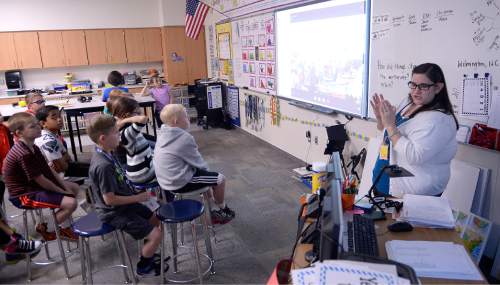 Al Hartmann  |  The Salt Lake Tribune 
Robin Farnsworth teaches social studies at Neil Armstrong Academy in West Valley City. In today's lesson her third-grade class is Skyping with another third-grade class in Willmington, N.C. Students interacted back and forth learning about Utah and North Carolina. Farnsworth uses technology and methods to engage children in learning.