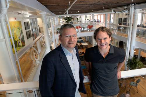 Al Hartmann  |  The Salt Lake Tribune
Former city Councilman Soren Simonsen, left, and Dustin Haggett, co-founder and CEO of  Impact Hub, pose for a photo in the renovated, historic building located at 150 S. State St. It recently opened its doors to the permanent home of Impact Hub Salt Lake, a co-working space, think-tank and incubator for social entrepreneurs.
