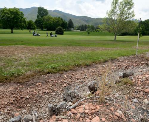 Al Hartmann |  The Salt Lake Tribune
Neighbors are complaining about Salt Lake City's plan to save water on Bonneville Golf Course by halting watering of grass and vegetation along the perimeters. The part of the course along Wasatch Drive is especially dry and weedy with occasional trash and broken glass.