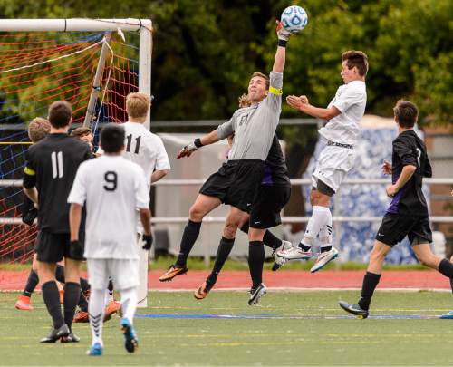 Trent Nelson  |  The Salt Lake Tribune
Lehi's Tanner Munson (51) knocks the ball away during the 5A boys' soccer semifinal with Alta vs. Lehi High School, in Woods Cross, Tuesday May 19, 2015.