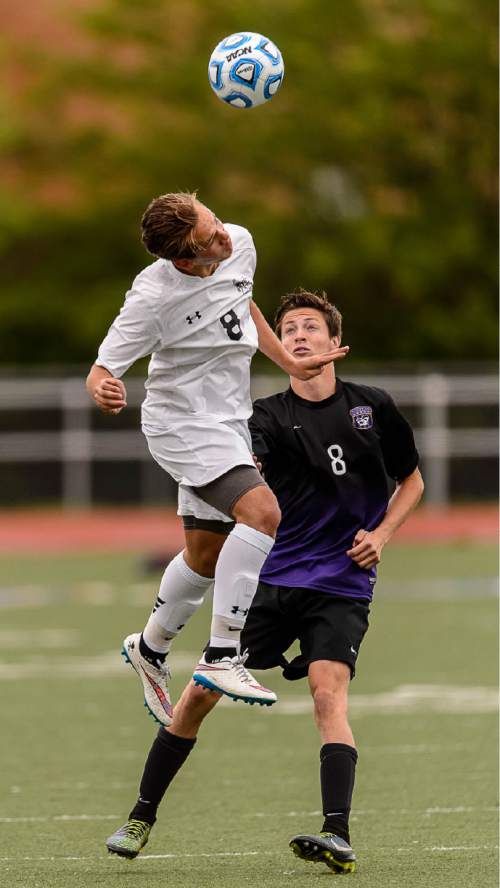 Trent Nelson  |  The Salt Lake Tribune
Alta's Elliott Smith heads the ball, with Lehi's Alex Sorenson (8) at rear, during the 5A boys' soccer semifinal with Alta vs. Lehi High School, in Woods Cross, Tuesday May 19, 2015.