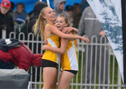 Scott Sommerdorf   |  The Salt Lake Tribune
Brooklyn Lott, left, and Hannah Morby hug after they saw team mate Abby Taylor sprint the last leg of the race to win the Girl's 3A 4x100 meter race at the 2015 Utah State High School Track and Field Championships, held at Clarence Robinson stadium at BYU, Saturday, May 16, 2015.