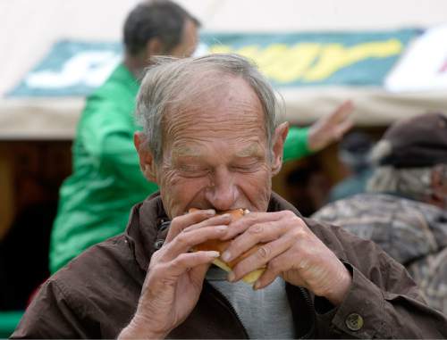 Al Hartmann |  The Salt Lake Tribune
Richard Clark bites into a sandwich at the Sixth Annual Subway Day in Pioneer Park Tuesday May 19, 2015. Subway Restaurants of Utah teamed up with the Rescue Mission of Salt Lake for "Subway Day" for the past six years. This event not only provides food, but will give the homeless and low income new shoes, and clothing along with other needed items.