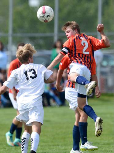 Scott Sommerdorf   |  The Salt Lake Tribune
Brighton's Ben Frankhauser deflects the ball while being marked by Alta's Colbey Morf. Alta beat Brighton 3-0 at Alta High, Thursday, May 7, 2015.