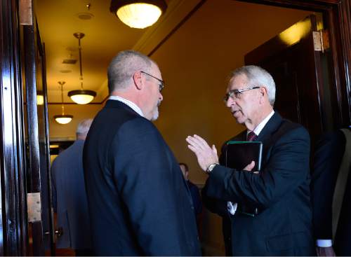 Scott Sommerdorf   |  The Salt Lake Tribune
Utah State President Stan Albrecht chats with Senator Stephen Urquhart, R-St. George in the hallways of the Utah Senate, Thursday, February 12, 2015.