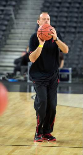 Steve Griffin  |  The Salt Lake Tribune

University of Utah head coach Larry Krystkowiak fires a half court shot with his team during practice on the NRG Stadium court prior to their 2015 NCAA Men's Basketball Championship Regional Semifinal game against Duke in Houston, Thursday, March 26, 2015.
