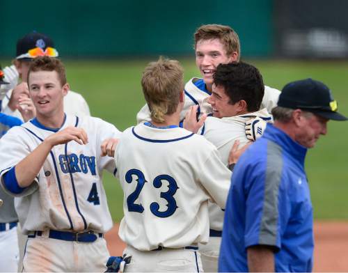 Scott Sommerdorf   |  The Salt Lake Tribune
Players mob Pleasant Grove's Easton Walker, back right, after he doubled home the winning run in the bottom of the 7th inning. Pleasant Grove defeated Cottonwood 3-2 to win the winner's bracket final at UVU, Thursday, May 21, 2015.