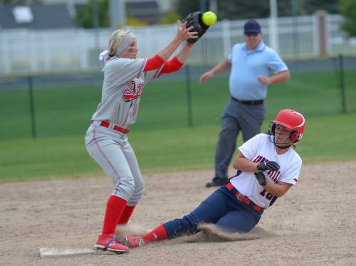 Leah Hogsten  |  The Salt Lake Tribune
Springville's Rylee Harris slides safely into second before Spanish Fork's Cheyenne Pratt makes the catch. Spanish Fork High School girls softball team defeated Springville High School 7-1 during their 4A state semifinal game Thursday, May 21, 2015 at the Taylorsville Valley Softball Complex.