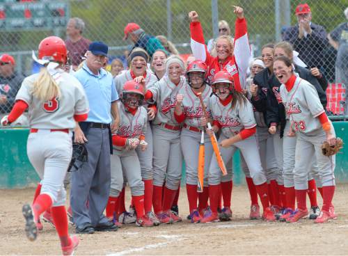 Leah Hogsten  |  The Salt Lake Tribune
Spanish Fork's Kenzie Branch is welcomed at home plate after hitting a home run in the 6th inning bringing runner Whitney Perkins. Spanish Fork High School girls softball team defeated Springville High School 7-1 during their 4A state semifinal game Thursday, May 21, 2015 at the Taylorsville Valley Softball Complex.