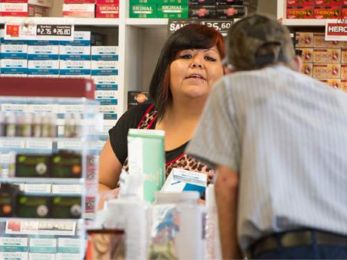 Rick Egan  |  The Salt Lake Tribune

Misty Snow works at the Convenience Store and Smoke Shop run by the Shivwits Band of Paiutes on tribal land near St. George, Utah,  Tuesday, May 5, 2015.