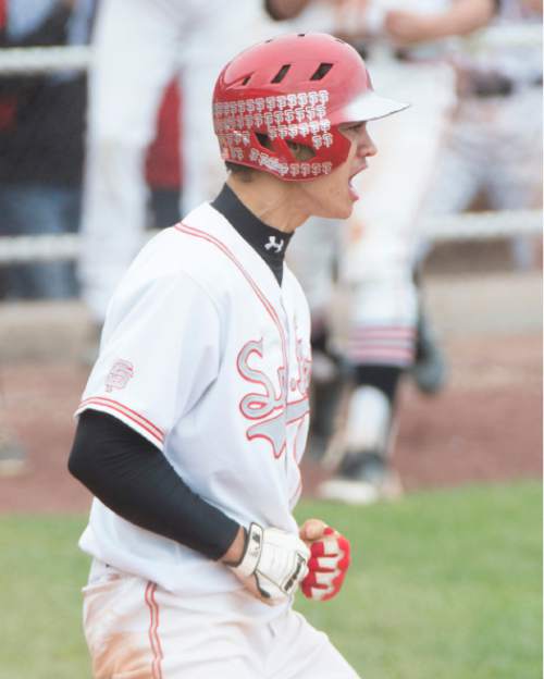 Rick Egan  |  The Salt Lake Tribune

Spanish Fork Dons Nic Roberts (2) reacts after he scored the go-ahead run in the 6th inning, as he scores on a double by Devin Argyle (15), in prep 4A baseball playoff action, Spanish Fork vs Maple Mountain, at Brent Brown field in Orem, Friday, May 22, 2015.