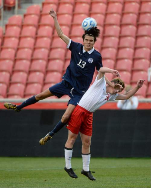 Francisco Kjolseth  |  The Salt Lake Tribune 
Skyline's Sheldon Martineau, left, and Isaac Jacobs of East explode in game action during the 4A boys' soccer championship game at Rio Tinto Stadium on Thursday, May 21, 2015.