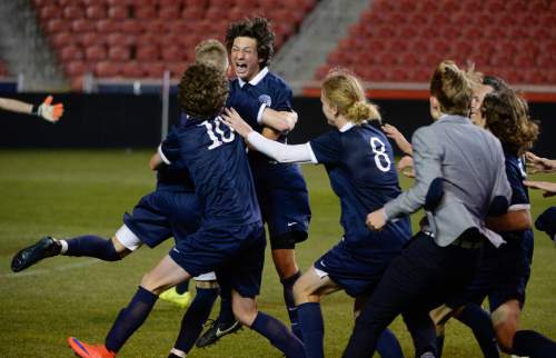 Francisco Kjolseth  |  The Salt Lake Tribune 
Skyline's Andrew Garcia is mobbed by his teammates after kicking the winning goal against East High in final shoot out during the 4A boys' soccer championship game at Rio Tinto Stadium on Thursday, May 21, 2015.